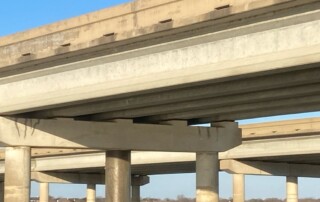 Close up view of bridge piling encapsulation. UCC experts utilized advanced fiberglass wrap technology to reinforce multiple bridge piles.