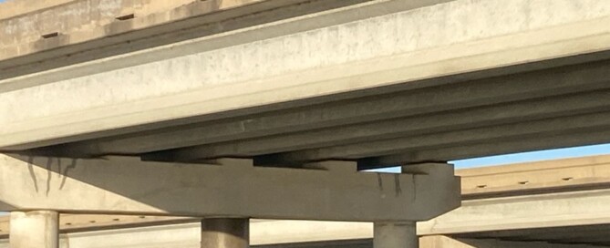 Close up view of bridge piling encapsulation. UCC experts utilized advanced fiberglass wrap technology to reinforce multiple bridge piles.