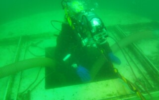 diver entering underwater tunnel